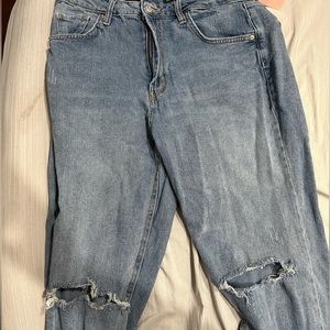 Pair of jeans with ripped knees
